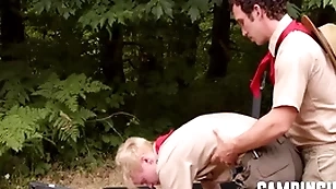 Camp trainer motivates twink give workout